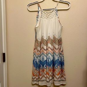 Junior dress size Sm. Spaghetti straps, lined slip. Ties at the back. Like new